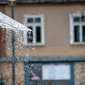 rain-dripping-from-awning-in-front-of-building-background-with-selective-focus-and-copy-space.jpg
